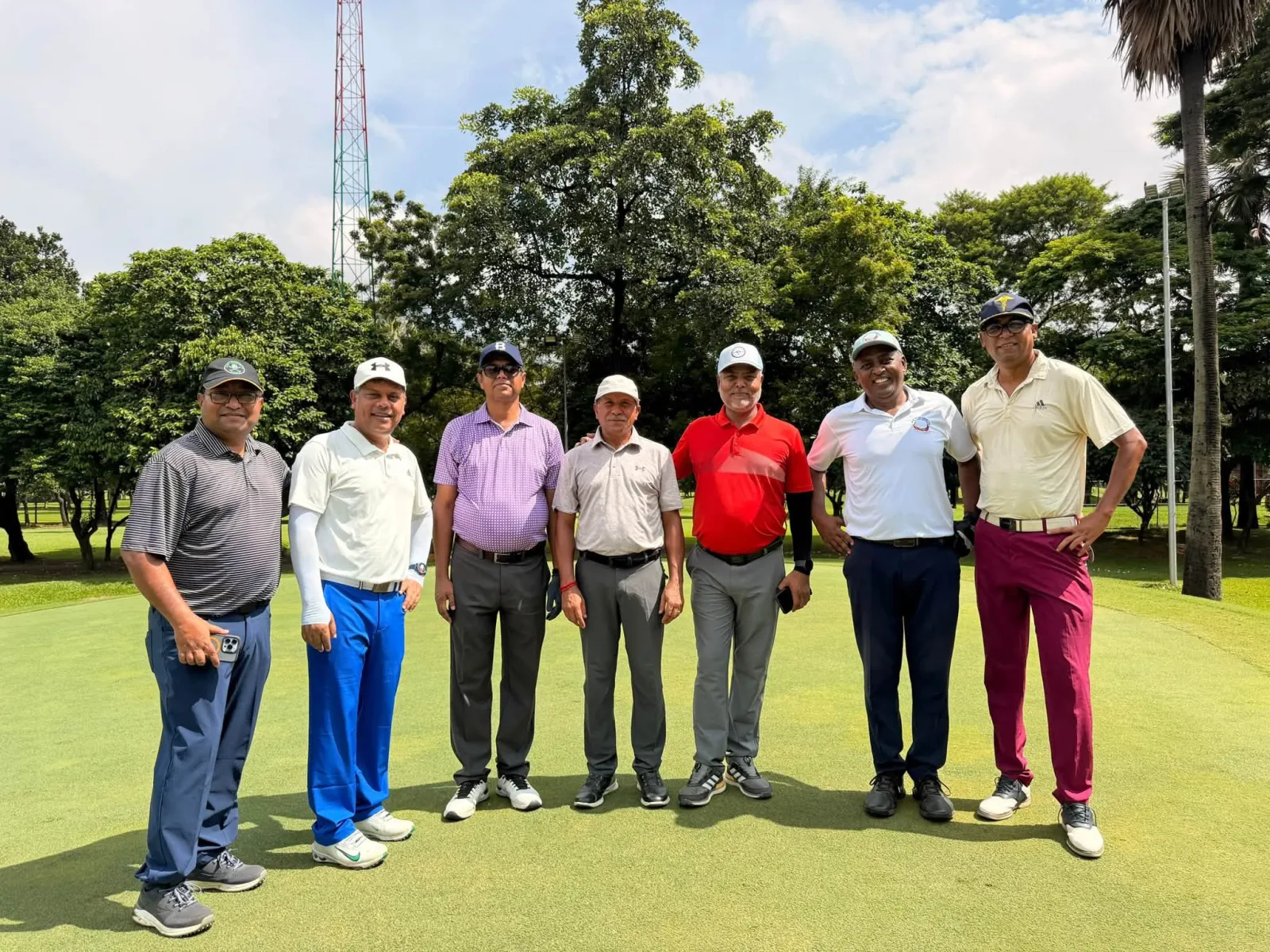 A fourball on the green before teeing off